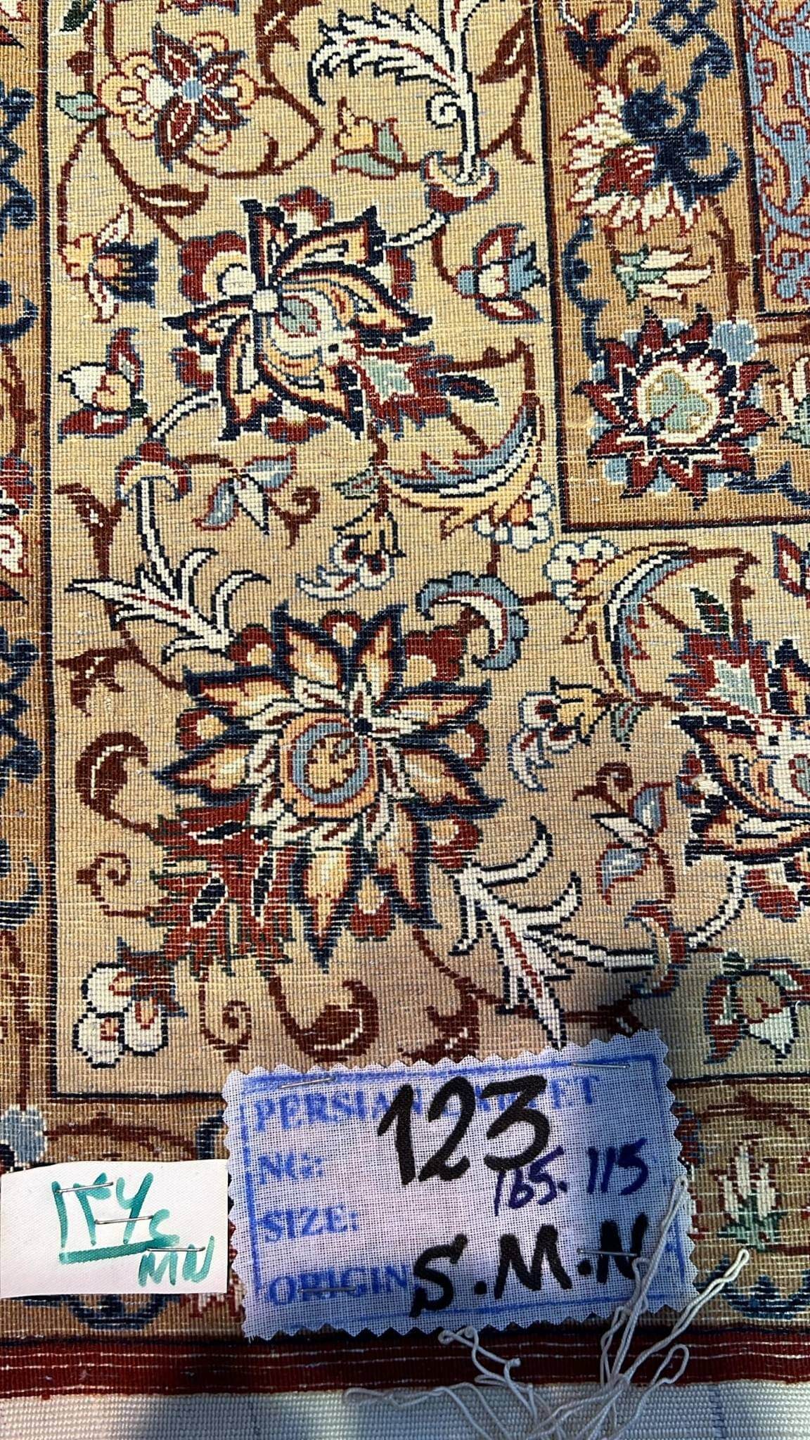 "Backside of a hand-knotted Seirafian Persian rug, crafted by Master Hassan Seirafian in Isfahan, displaying detailed knotwork and silk warp for premium durability."